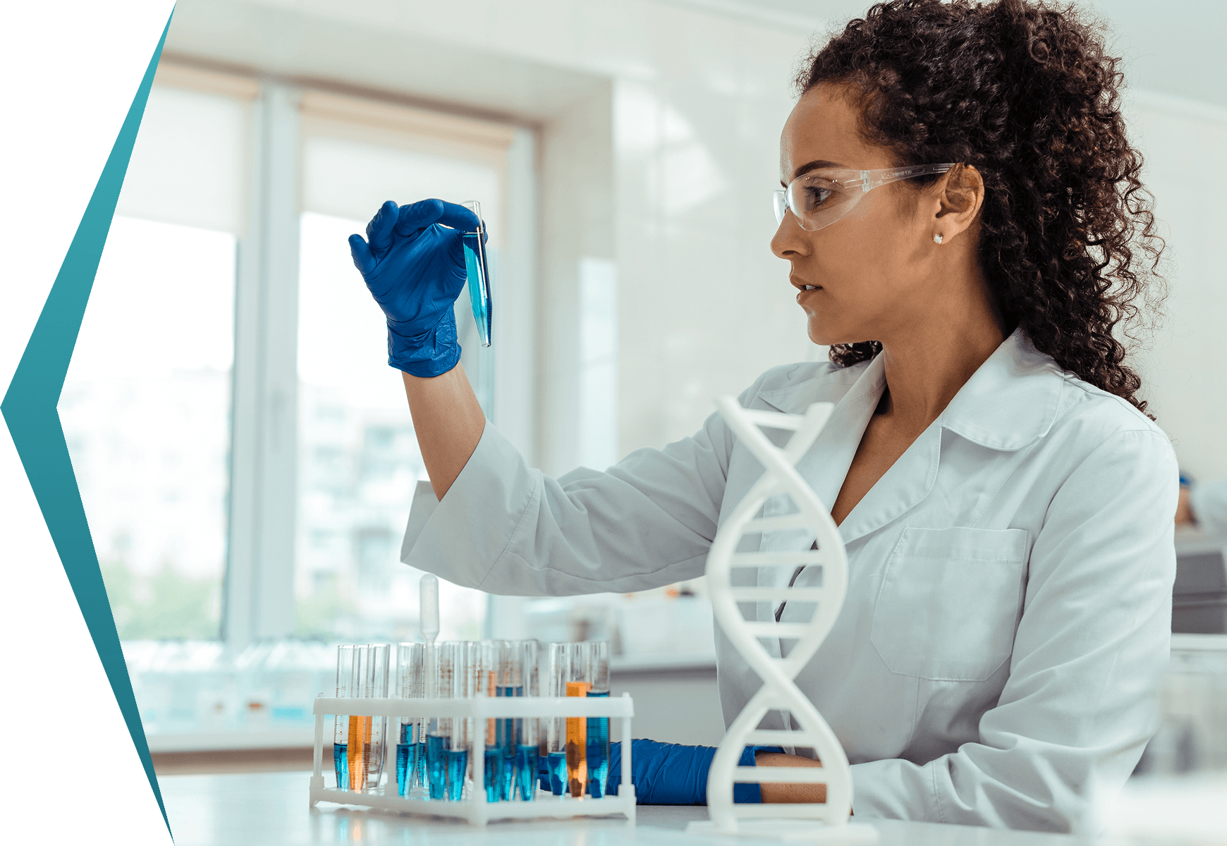 Scientist examining test tube in laboratory.